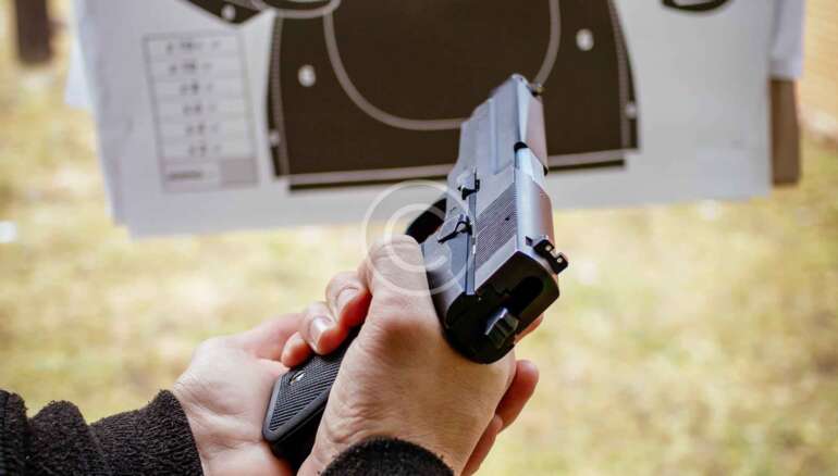 handgun forward facing a target